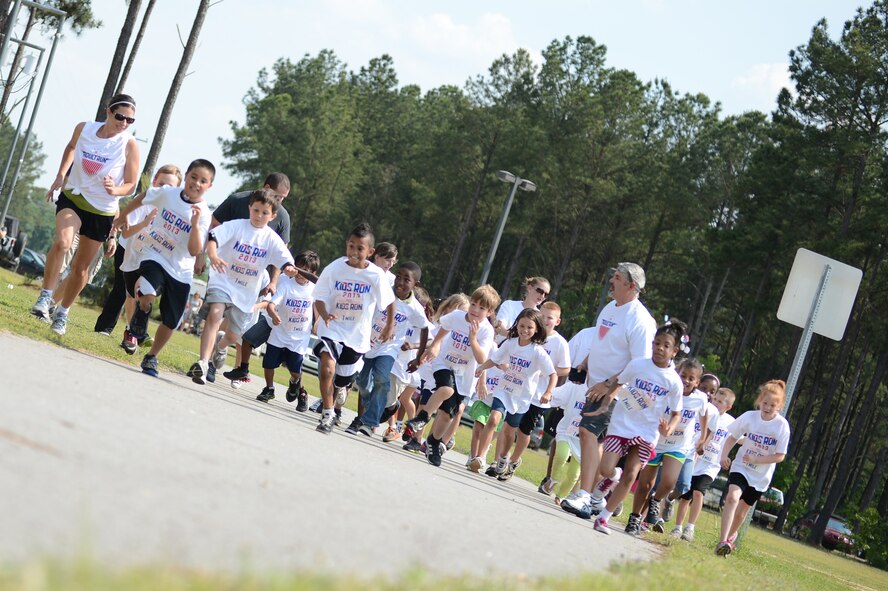 Children in the 7 to 8-year-old category of the America’s Kids Run event sprint out of the box as they start their one-mile run at Shaw Air Force Base, S.C., May 10, 2013. The top five from each category received ribbons for their efforts. There were 175 participants, 139 of which were children, while 36 adults joined in the race to support the children. (U.S. Air Force photo by Airman 1st Class Daniel Blackwell/Released)