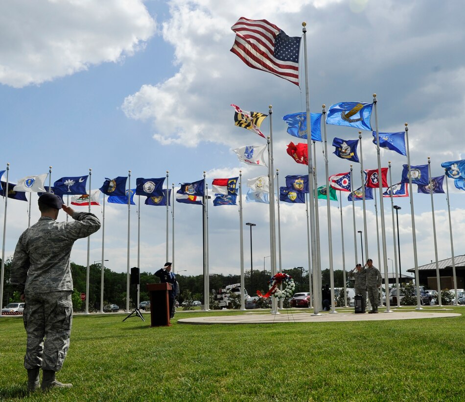 Security Forces members salute during Joint Base Andrews’ National Police Week Formal Retreat Ceremony on May 13, 2013. In 1962, President John F. Kennedy signed a proclamation designating May 15 as Peace Officers Memorial Day and the week in which that date falls as Police Week. (U.S. Air Force photo/Airman 1st Class Nesha Humes)