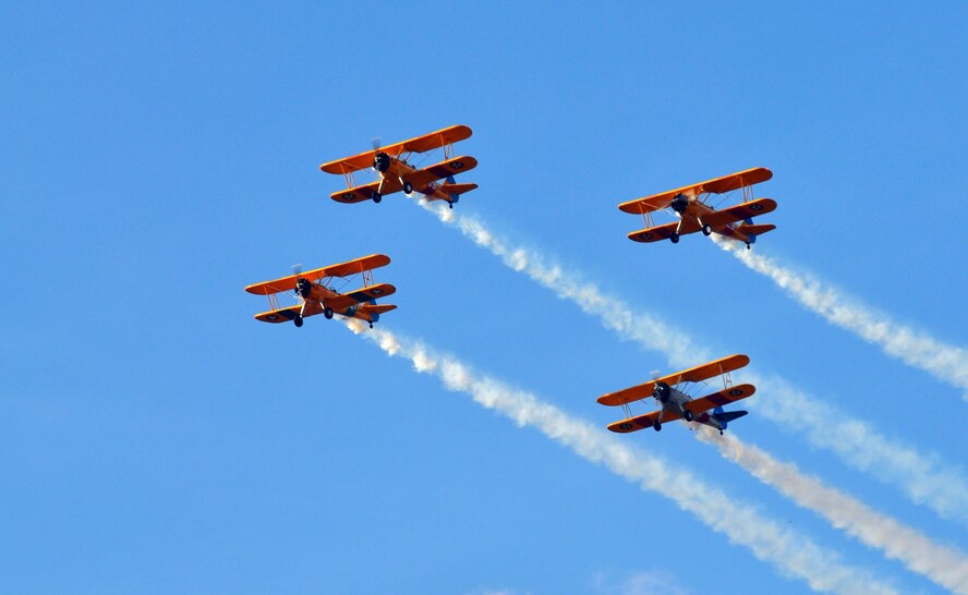 The local Experimental Aircraft Association performed a flyover of biplanes in the “missing man" formation May 10, 2013, in honor of the members killed in the recent KC-135 Stratotanker crash in Kyrgyzstan on May 3. Capt. Mark “Tyler” Voss was one of the members killed in the crash and was a member of the chapter and was working on an experimental plane. (U.S. Air Force photo by 2nd Lt. Rachelle Smith) 