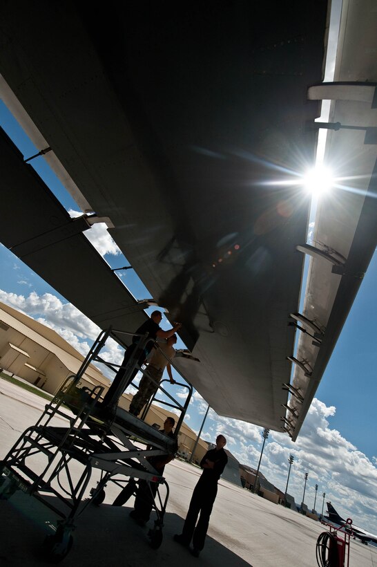 Airmen from the 28th Aircraft Maintenance Squadron hydraulic shop, inspect the hydraulic wiring on the wing of a B-1 bomber during routine maintenance at Ellsworth Air Force Base, S.D., May 8, 2013. Aircraft hydraulic specialists are one of six specialties in the 28th AMXS specialist section responsible for making sure the many systems of the B-1s at Ellsworth function properly. (U.S. Air Force photo by Airman 1st Class Zachary Hada/Released)