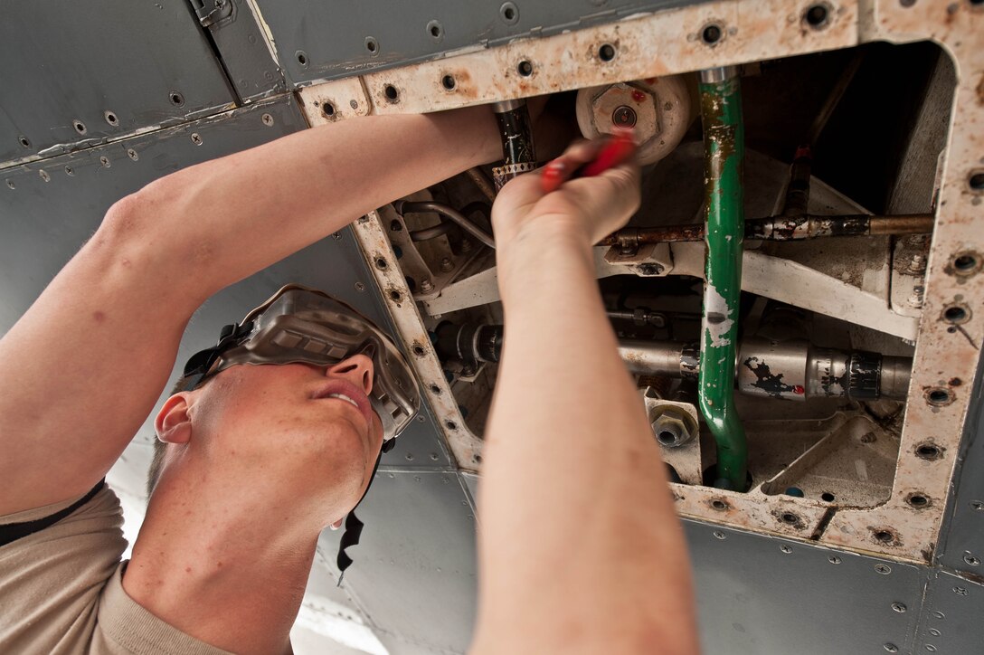 Airman 1st Class Jeremiah Palmer, 28th Aircraft Maintenance Squadron hydraulic technician, installs a pre-cooler blower on a B-1 bomber during routine maintenance at Ellsworth Air Force Base, S.D., May 8, 2013. Aircraft hydraulic system specialists are responsible for everything that deals with hydraulic and pneumatic systems, including landing gear, brakes, flight controls, weapons and cargo door systems. (U.S. Air Force photo by Airman 1st Class Zachary Hada/Released)