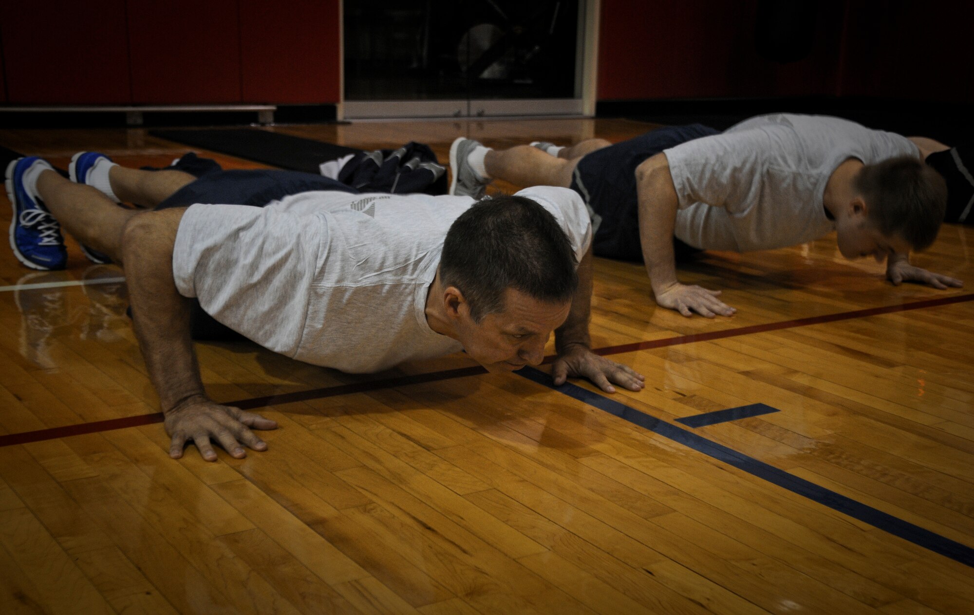 Col. Jeffrey S. Kozak, 911th Airlift Wing vice commander, performs a proper push-up during his physical fitness assessment, held at the Pittsburgh International Airport Air Reserve Station, May 4, 2013. Kozak, along with all military members of the 911th must comply with the U.S. Air Force physical fitness standards found in AFI 36-2905 along with the Wing’s newly instituted Airlift Wing Instruction to ensure members success in passing and staying current with their physical readiness.  To find out more on the Wing’s new Fitness Instruction contact a Unit Fitness Program Manager to learn more about additional changes to the base’s fitness program.  Fitness equals readiness, which is everyone’s responsibility. (U.S. Air Force photo by Senior Airman Joshua J. Seybert/Released)