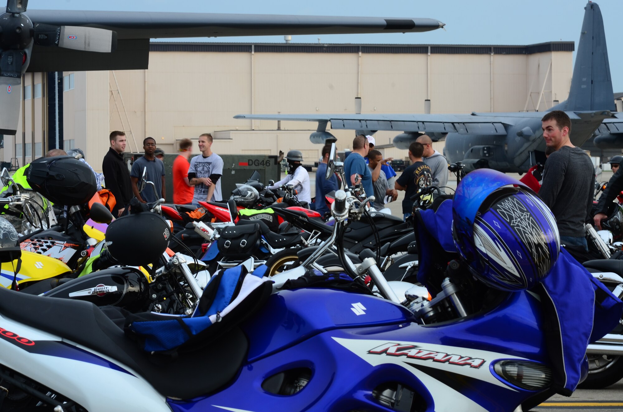 Motorcycle riders check out each other’s bikes during the Motorcycle Safety Rally on the flight line on Hurlburt Field, Fla., May 10, 2013. Active-duty, retired and DOD cardholders came out to attend the event, which included a brief on safety and use of proper personal protective equipment and an obstacle course ride demo by skilled riders from local law enforcement.
(U.S. Air Force Photo/ Staff Sgt. John Bainter)	
