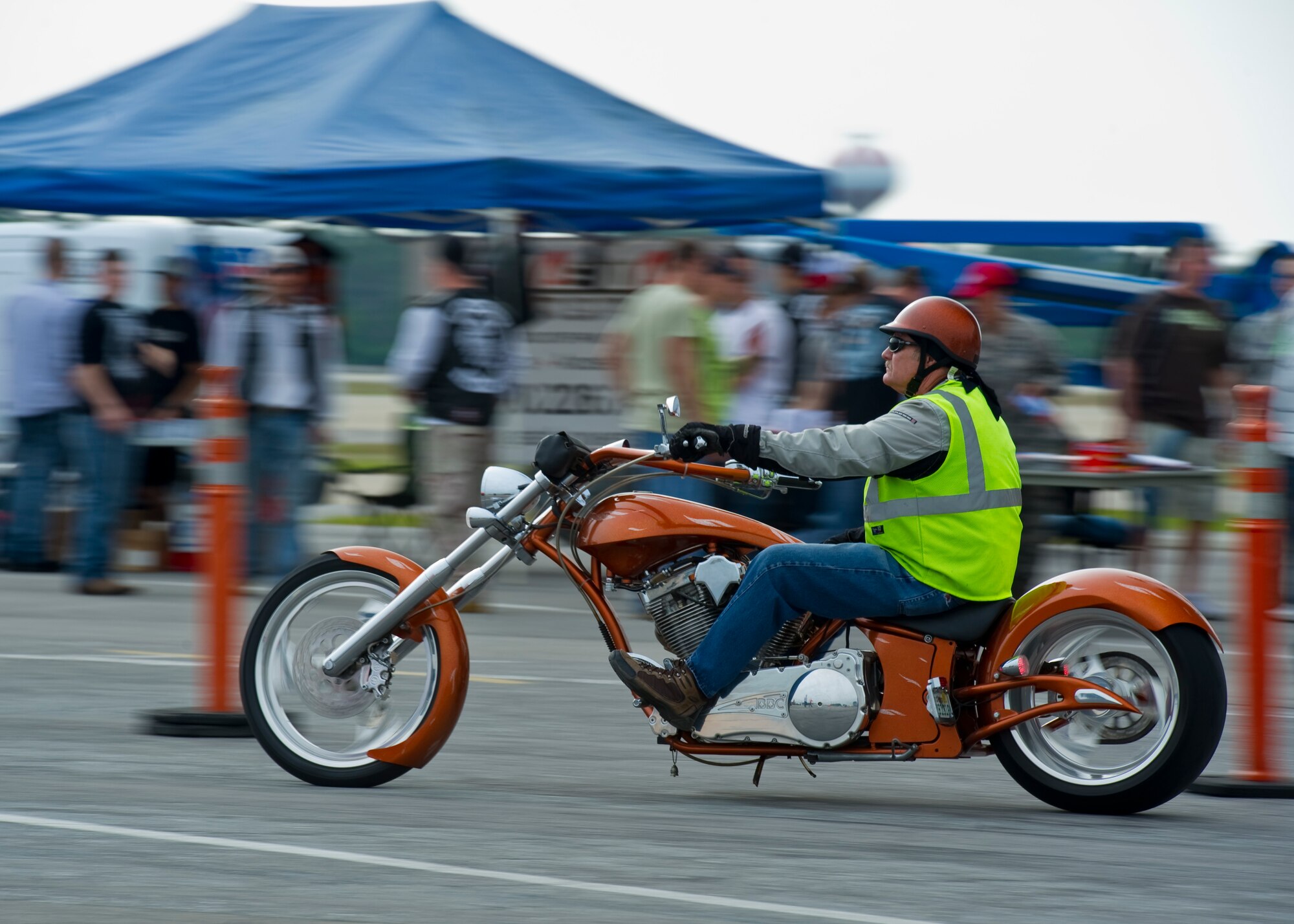 Bill Clausen, a command information technology architect with headquarters Air Force Special Operations Command arrives at the Motorcycle Safety Rally on the flight line on Hurlburt Field, Fla., May 10, 2013. Active-duty, retired and DOD cardholders came out to attend the event, which included a brief on safety and use of proper personal protective equipment and an obstacle course ride demo by skilled riders from local law enforcement.
(U.S. Air Force Photo/ Staff Sgt. John Bainter)
