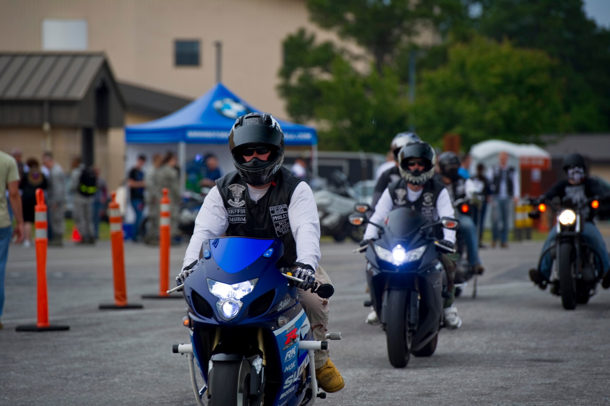 Riders enter the Motorcycle Safety Rally on the flight line on Hurlburt Field, Fla., May 10, 2013. The event provided riders with information on proper safety practices while riding, as well as information  from local law enforcement on the “do’s and don’ts” of riding a motorcycle.
(U.S. Air Force Photo/ Staff Sgt. John Bainter)
