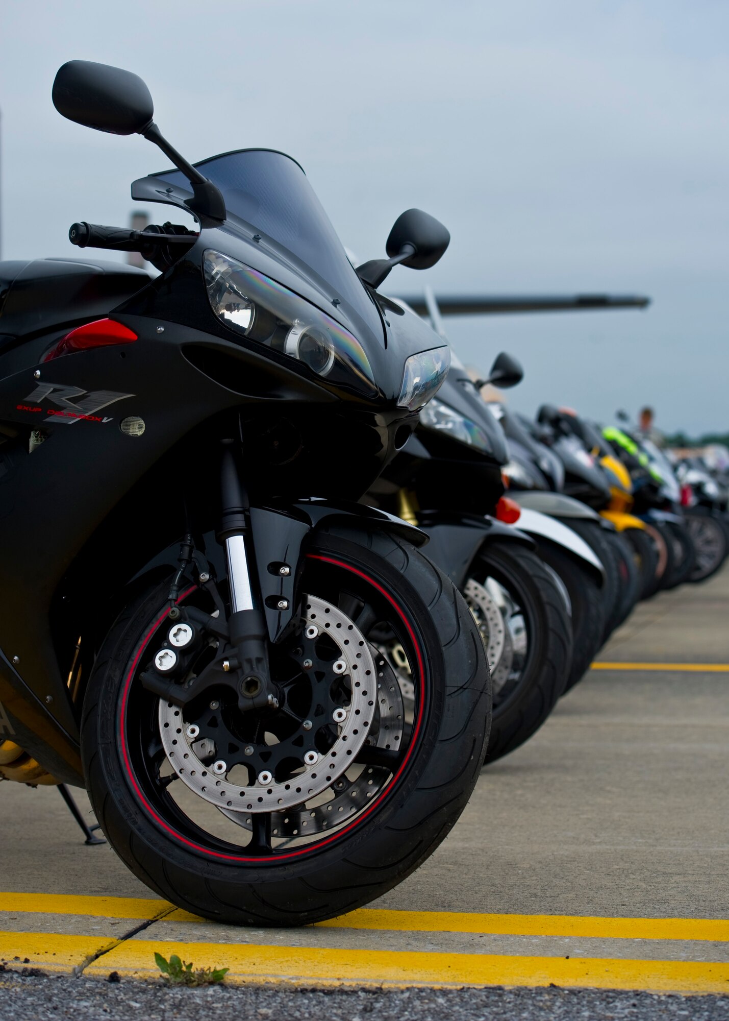 Parked motorcycles sit on the flight line during a Motorcycle Safety Rally on Hurlburt Field Fla., May 10, 2013. Active-duty, retired and DOD cardholders came out to attend the event, which included a brief on safety and use of proper personal protective equipment and an obstacle course ride demo by skilled riders from local law enforcement.
(U.S. Air Force Photo/ Staff Sgt. John Bainter)
