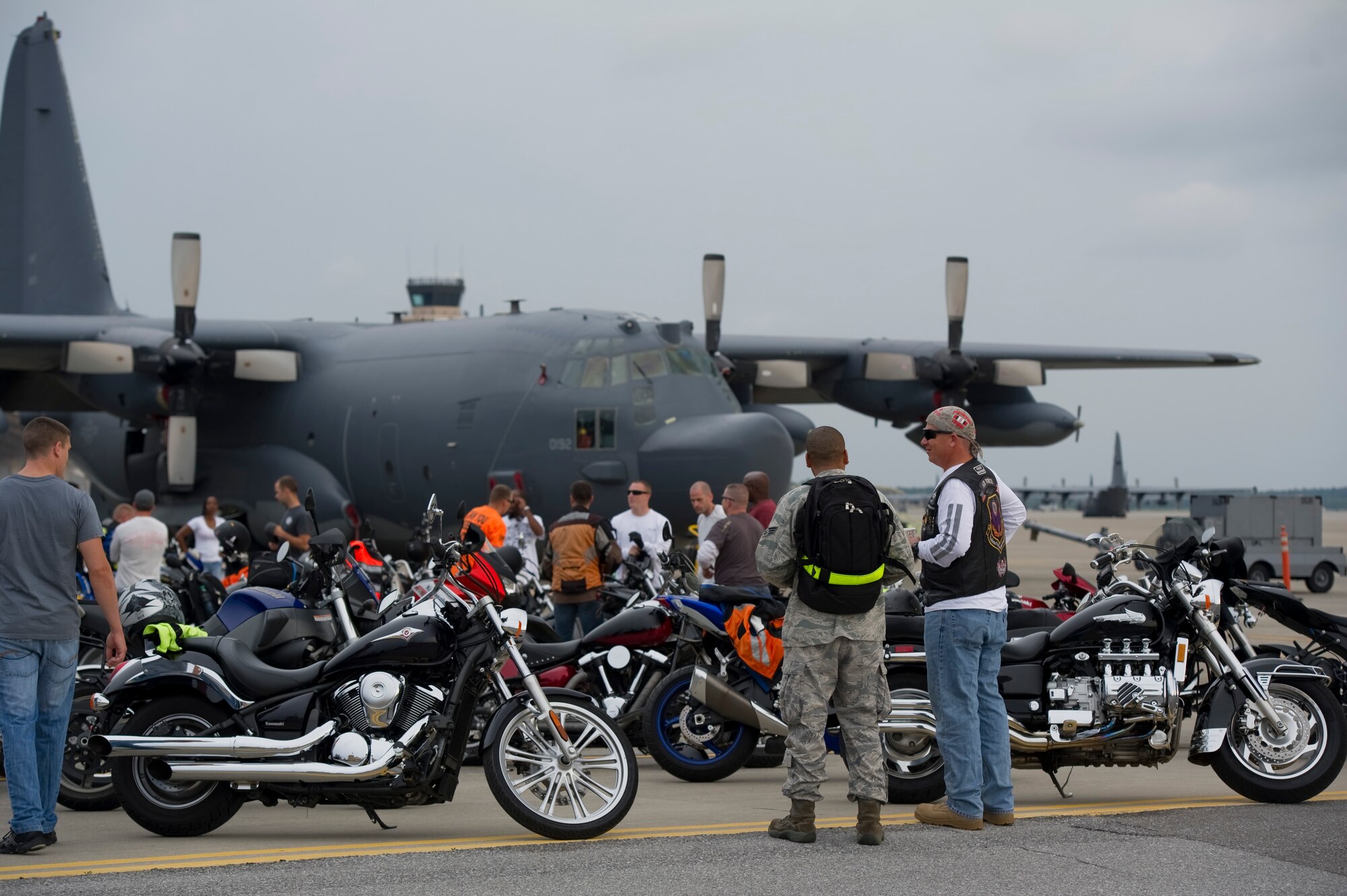 Motorcycle riders check out each other’s bikes during the Motorcycle Safety Rally on the flight line on Hurlburt Field, Fla., May 10, 2013. Active-duty, retired and DOD cardholders came out to attend the event, which included a brief on safety and use of proper personal protective equipment and an obstacle course ride demo by skilled riders from local law enforcement.
(U.S. Air Force Photo/ Staff Sgt. John Bainter)	

