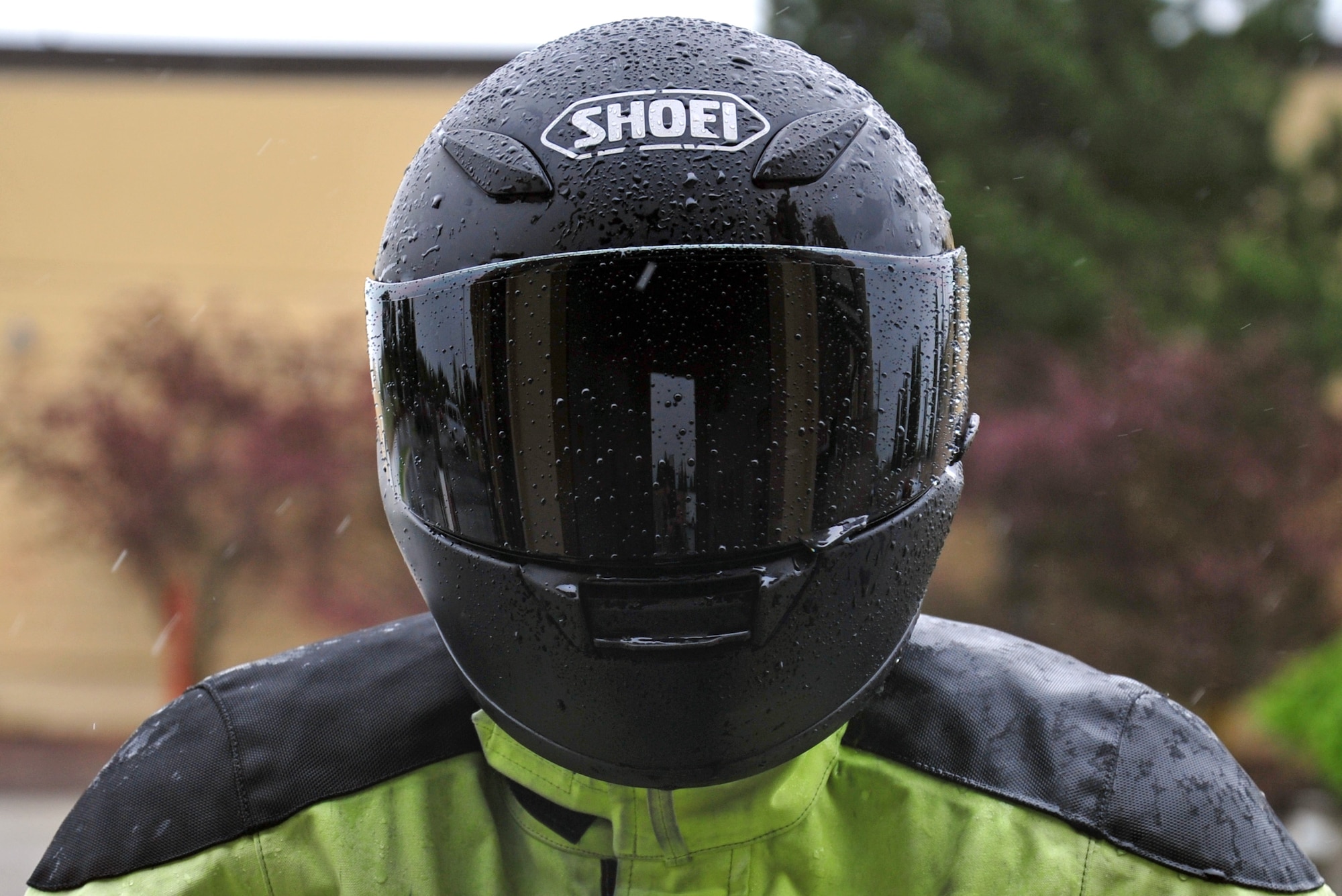Capt. Ryan Petersen displays proper wear of protective motorcycle equipment at Fairchild Air Force Base, Wash., May 13, 2013. Riders on base are required to wear helmets, goggles and reflective and/or brightly colored clothing. Petersen is the 92nd Operations Group executive officer. (U.S. Air Force photo by Senior Airman Taylor Curry)