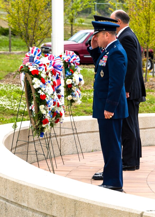 Brig. Gen. Kevin J. Jacobsen, OSI commander, and leadership representatives from the Naval Criminal Investigative Service, the Defense Security Service and the U.S. Army Criminal Investigation Command, pay their respects to the wreaths displayed in honor of each agency's members who died in the line of duty. The ceremony was held May 13 at the Russell Knox Building at Quantico, Va. (U.S. Air Force photo/Mr. Mike Hastings)