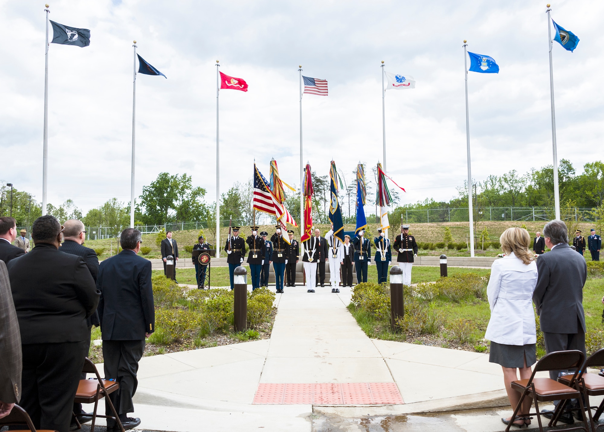 The Military District of Washington Joint Service Color Guard presents the colors during the Police Week wreath laying ceremony held May 13 at the Russell Knox Building at Quantico, Va. Four wreaths were displayed in honor of the fallen members from the Air Force Office of Special Investigations, the Naval Criminal Investigative Service, the Defense Security Service and the U.S. Army Criminal Investigation Command. (U.S. Air Force Photo/Mr. Mike Hastings)