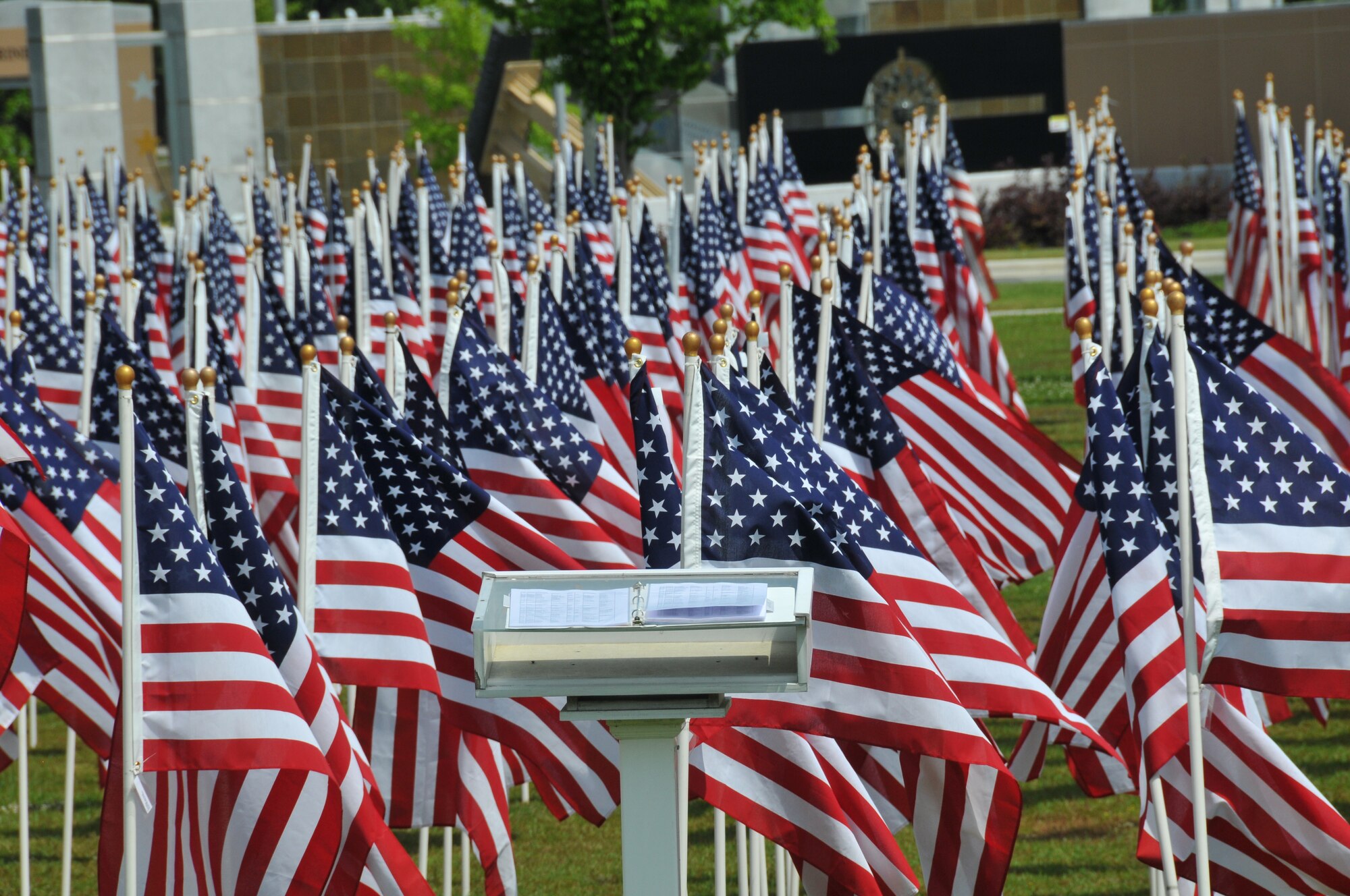 Almost 1,000 flags stand in the field in front of the museum, each flag honors someone who is currently serving, has served, or made the ultimate sacrifice for our nation.  A book with the names of each person being honored and the location of the flag stands at the front of the field for visitors to find the location of their service member being honored.  This is the seventh year the Field of Honor ceremony has been at held at the Airborne and Special Operations Museum in downtown, May 11, 2013, Fayetteville, N.C.  (U.S. Air Force photo by Adam Luther, 440 AW/PA)