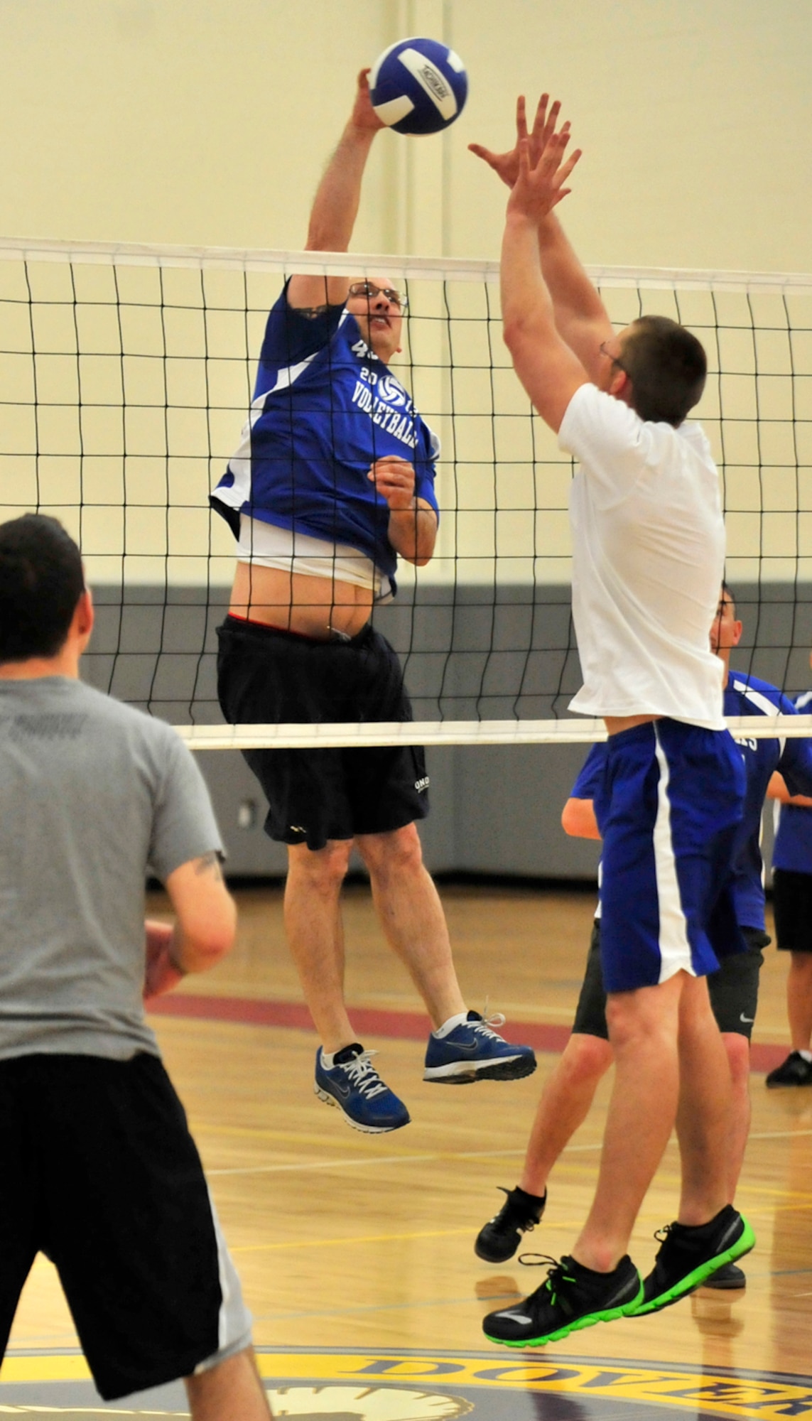 Patrick Piazza of the 436th Maintenance Squadron slams home a kill as the 436th Force Support Squadron tries to block during an intramural volleyball playoff game May 13, 2013, at the fitness center on Dover Air Force Base, Del. The 436th MXS swept the 436th FSS 25-10 and 25-19. (U.S. Air Force photo/Tech. Sgt. Chuck Walker)