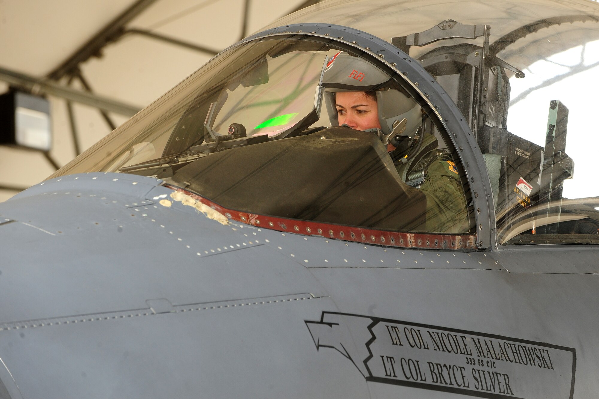U.S. Air Force Lt. Col. Nicole Malachowski, 333rd Fighter Squadron commander, conducts pre-flight inspections in an F-15E Strike Eagle prior to take-off on Seymour Johnson Air Force Base, N.C., May 8, 2013. Malachowski has recorded more than 2,100 flying hours in her career. (U.S. Air Force photo by Airman 1st Class John Nieves Camacho/Released)