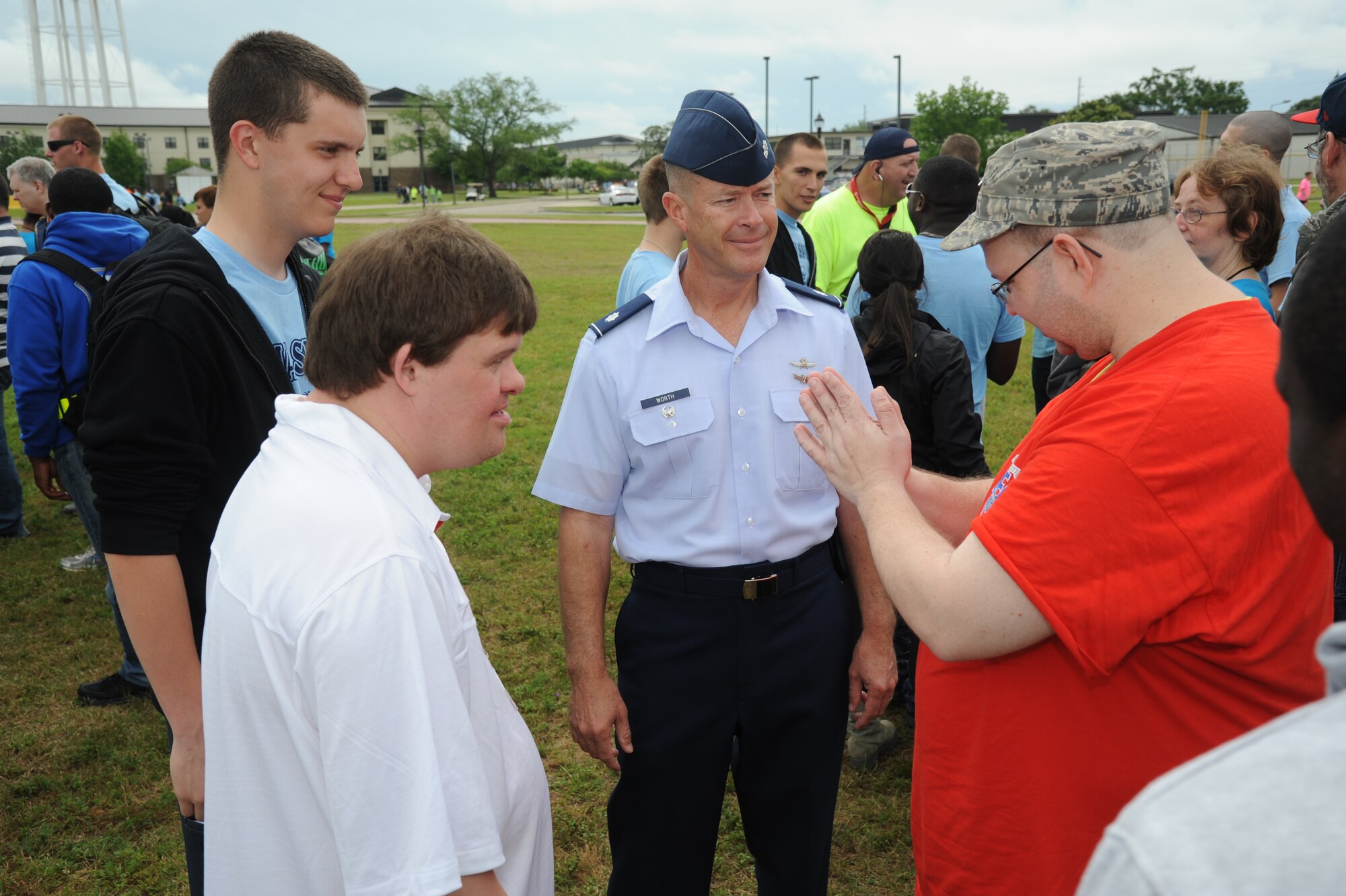 Lt. Col. Brian Worth, 81st Training Group, speaks to athletes and Airman sponsors at the Special Olympics Mississippi Summer Games on May 11, 2013, at Keesler Air Force Base, Miss.  More than 900 athletes and 3,000 volunteers worked together to hold competitions throughout the day.  This is the 27th year Keesler has hosted the state Special Olympics.   (U.S. Air Force photo by Kemberly Groue)