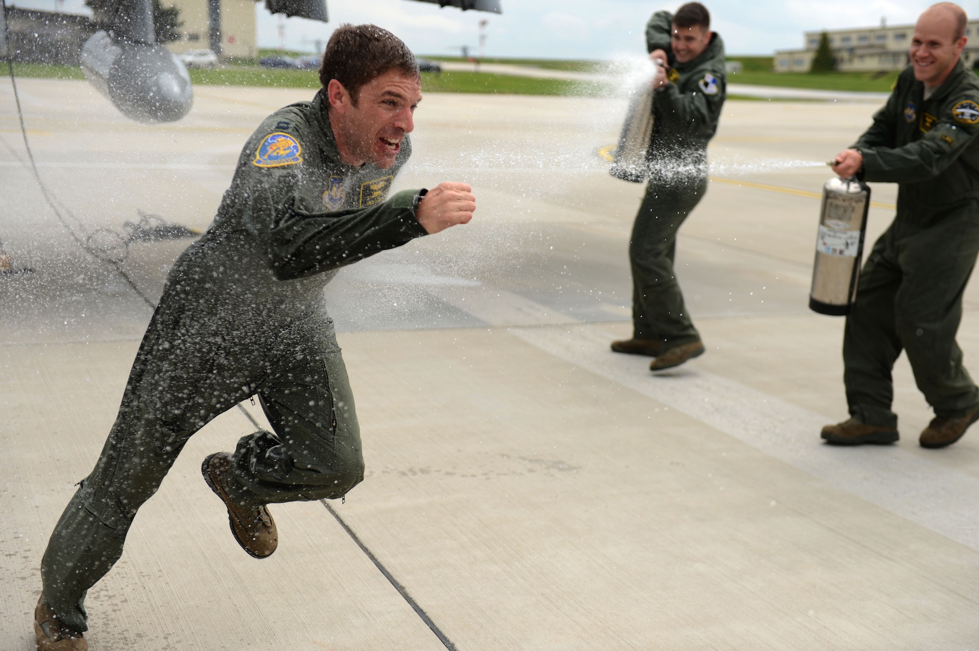 SPANGDAHLEM AIR BASE, Germany – U.S. Air Force Cap. Gregory Ulrich, 81st Fighter Squadron pilot from Fairfield, Calif., runs through a celebratory stream of water after the last A-10 Thunderbolt II attack aircraft tactical sortie at Spangdahlem AB May 14, 2013. The celebration marked the end of 20 years of A-10 operations on Spangdahlem AB. (U.S. Air Force photo by Airman 1st Class Gustavo Castillo/Released)
