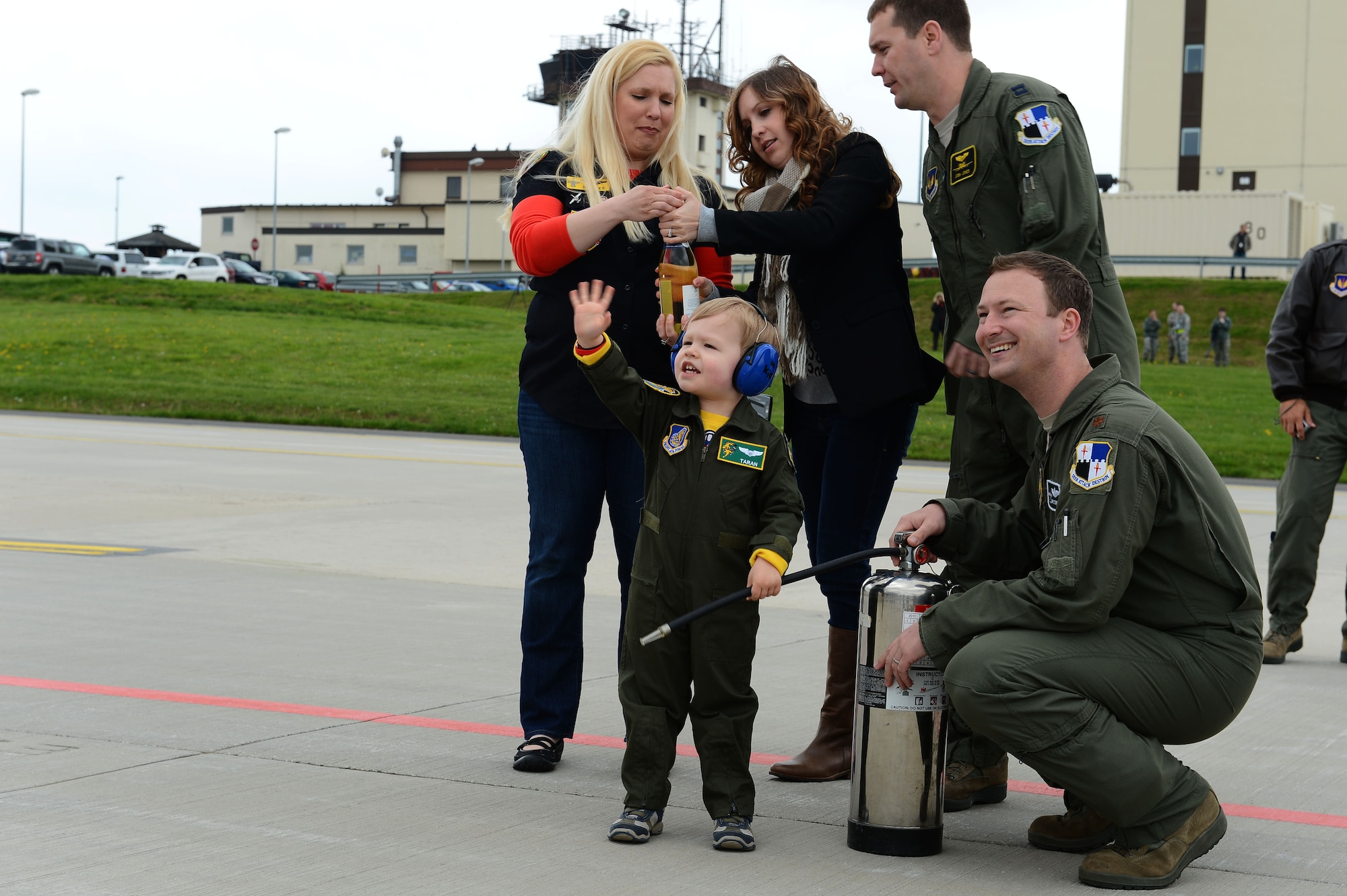 SPANGDAHLEM AIR BASE, Germany – Families and friends await the arrival of A-10 Thunderbolt II attack aircrafts on the flightline May 14, 2013. Families joined with onlookers to witness the landing of the final A-10 Thunderbolt II attack aircraft tactical sortie in Europe at Spandahlem AB. (U.S. Air Force photo by Tech. Sgt. Jonathan Pomeroy/Released)