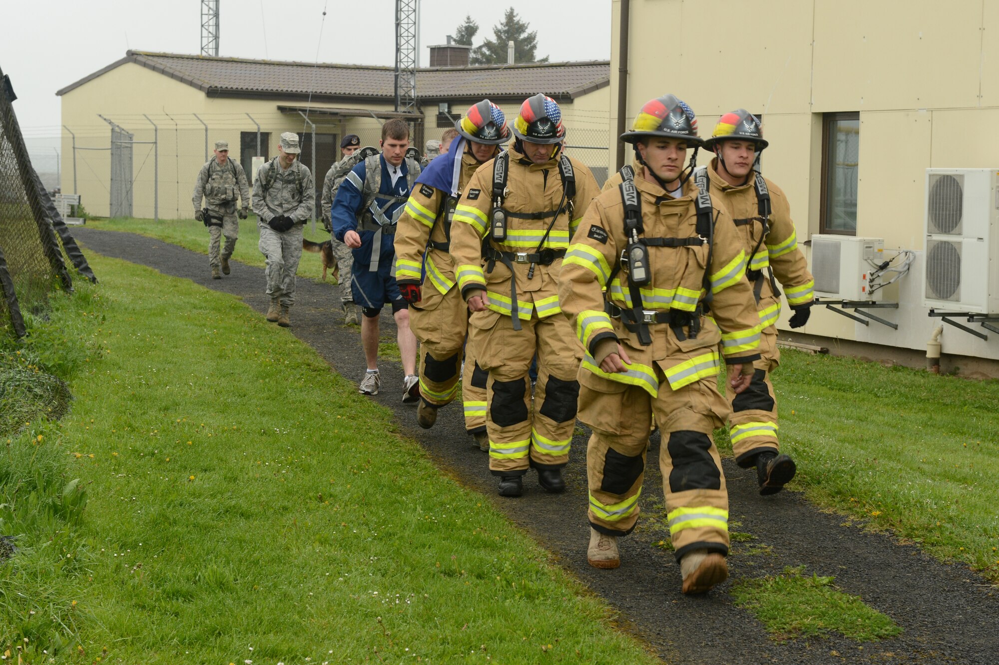 SPANGDAHLEM AIR BASE, Germany -- U.S. Air Force Airmen march around the perimeter of the base May 13, 2013. National Police Week began in 1962 and recognizes law enforcement officers who have lost their lives for the safety of others. Approximately 65 people participated in the march and were split into nine groups. (U.S. Air Force photo by Airman 1st Class Kyle Gese/Released)