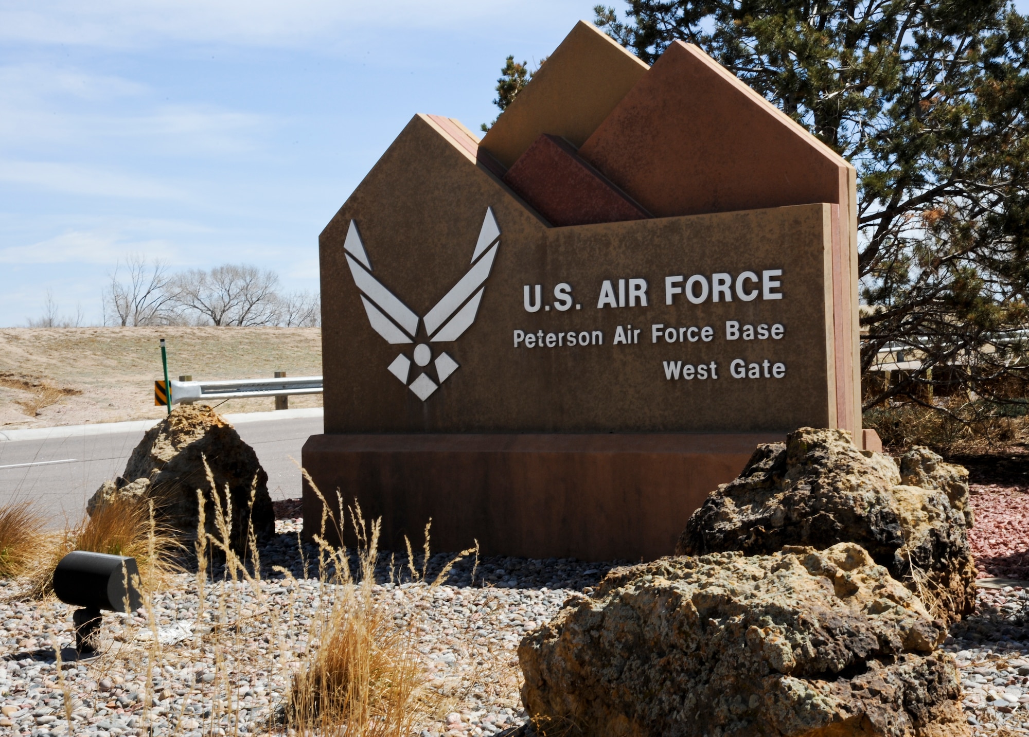Landscaping outside the West Gate will continue in May. Kentucky Bluegrass will be removed and new native Colorado grass will be planted to reduce water requirements and sustain wider temperature variations. (U.S. Air Force photo/Michael Golembesky)