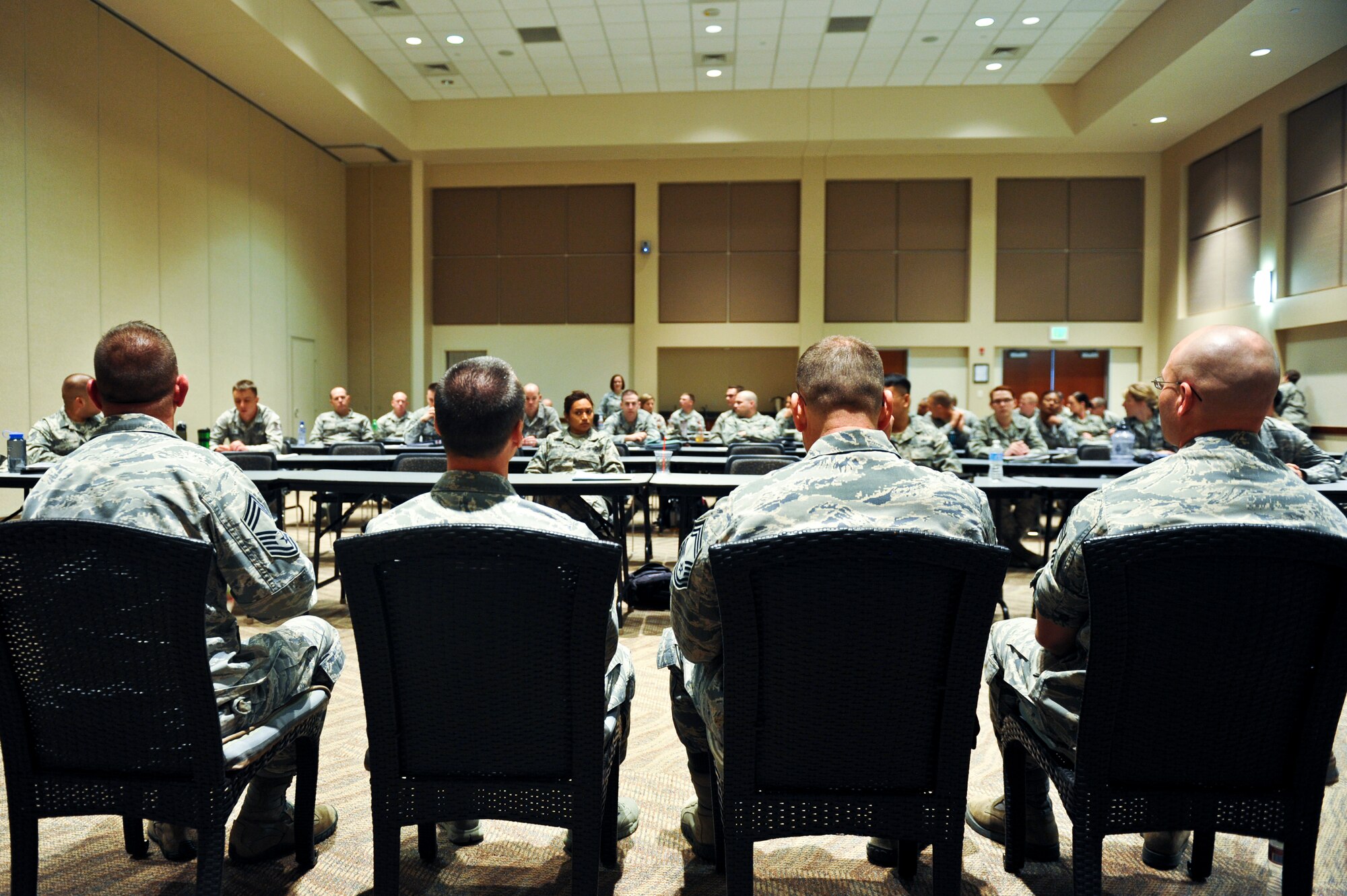 Four chief master sergeants answer questions from the participants of the week long additional-duty first sergeant symposium May 11, 2013, at the Leadership Development Center on Buckley Air Force Base, Colo. The chiefs shared their experiences relating to first sergeant duty and answered questions the new additional-duty first sergeants had concerning their new responsibilities. (U.S. Air Force photo by Airman 1st Class Riley Johnson/Released)