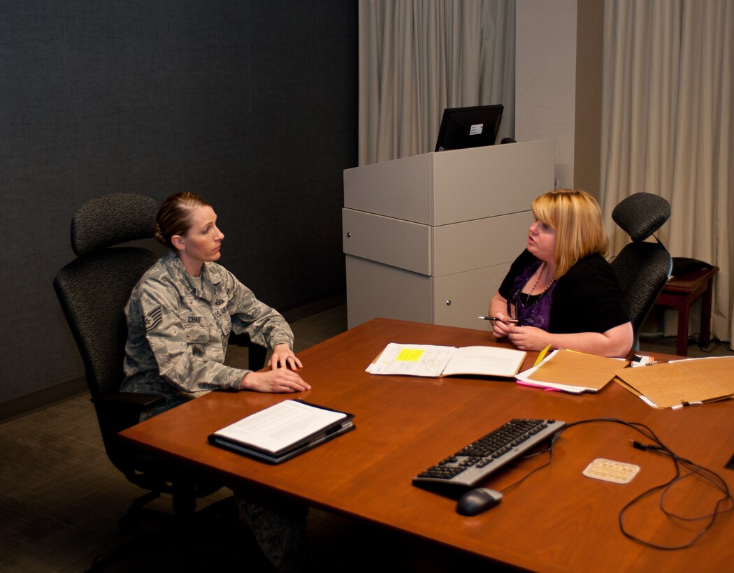 Tech. Sgt. Jacqueline Chant, 28th Communications Squadron client systems section chief, asks Cheryl Holt, 28th Force Support Squadron education services specialist, about education benefits during her visit to the 28th CS on Ellsworth Air Force Base, S.D., May 7, 2013. For more information on when and where the education office will visit this month call their office at (605) 385-6388. (U.S. Air Force photo by Airman 1st Class Alystria Maurer/Released)
