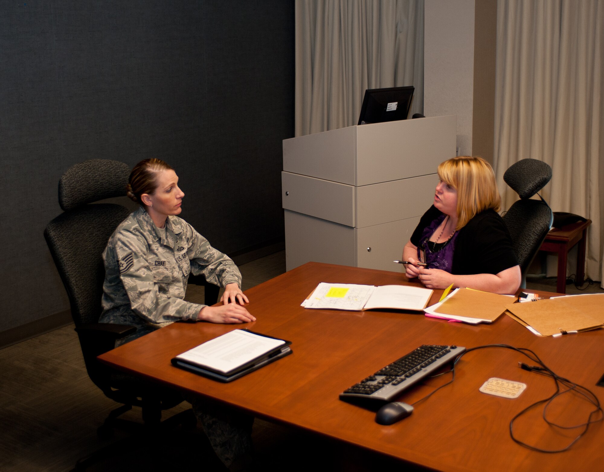 Tech. Sgt. Jacqueline Chant, 28th Communications Squadron client systems section chief, asks Cheryl Holt, 28th Force Support Squadron education services specialist, about education benefits during her visit to the 28th CS on Ellsworth Air Force Base, S.D., May 7, 2013. For more information on when and where the education office will visit this month call their office at (605) 385-6388. (U.S. Air Force photo by Airman 1st Class Alystria Maurer/Released)