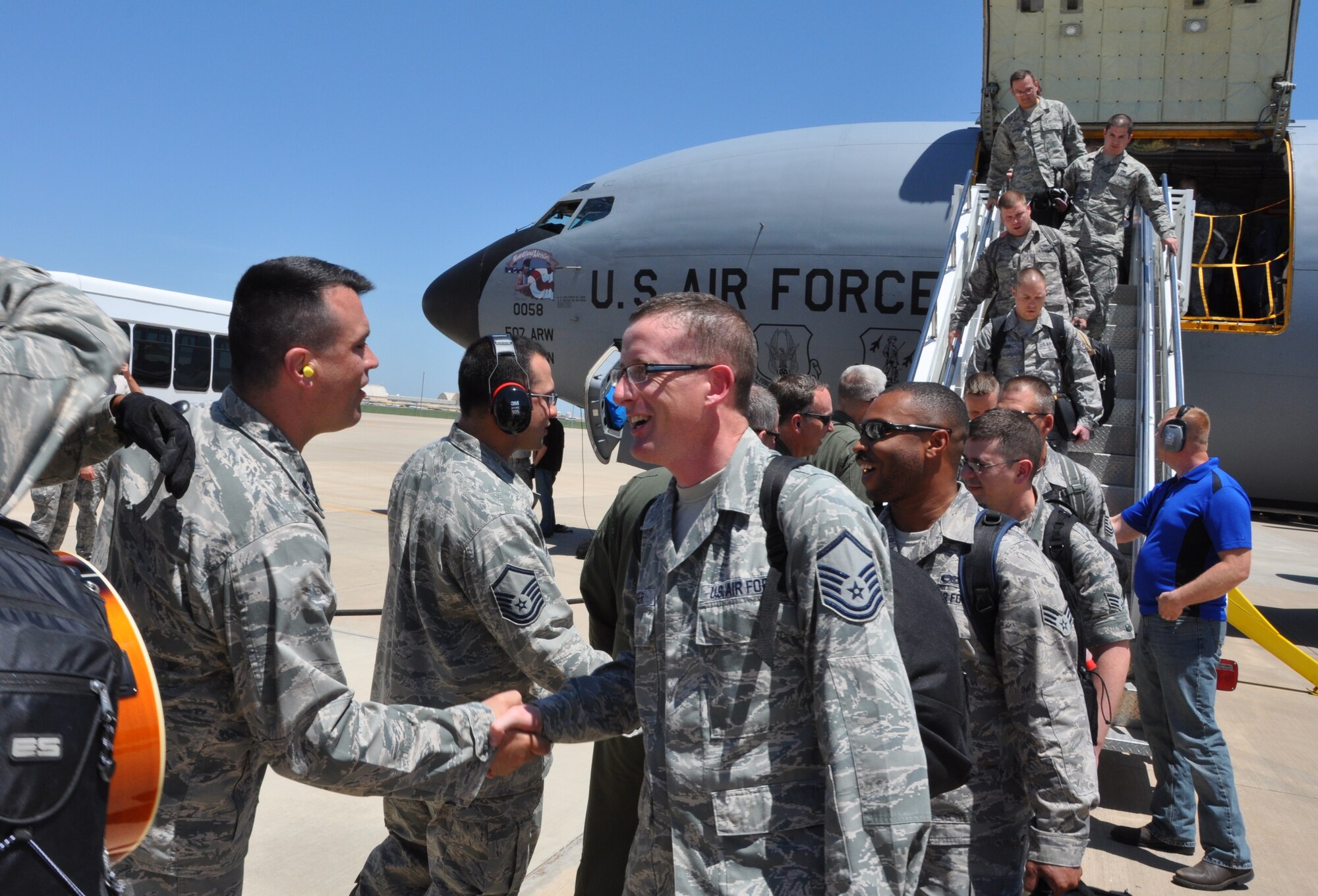 Lt. Col. Bradely Garcia, 507th Maintenace Squadron commander welcomes Master Sgt. Camerson Dinger, 507th MXS and 20 other Reservists that returned home from South West Asia here May 13. The 507th ARW Reservists served five months supporting on-going air refueling operations in U.S. Central Command area of responsibility. (U.S. Air Force photo by Maj. Jon Quinlan) 