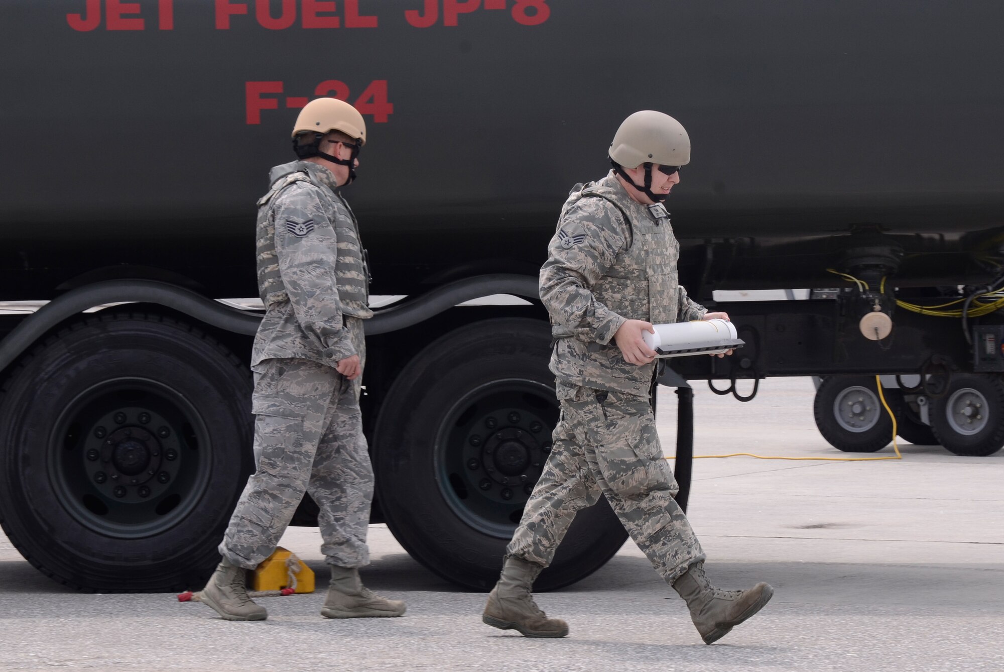 Personnel from the 94th Explosive Ordnance Flight remove a simulated suspicious package during an exercise scenario on Dobbins Air Reserve Base, Ga.  May 10. The scenario evaluated the response time and operating procedures of first responders, and explosive ordnance personnel from the 94th Airlift Wing. (U.S. Air Force photo/Don Peek)