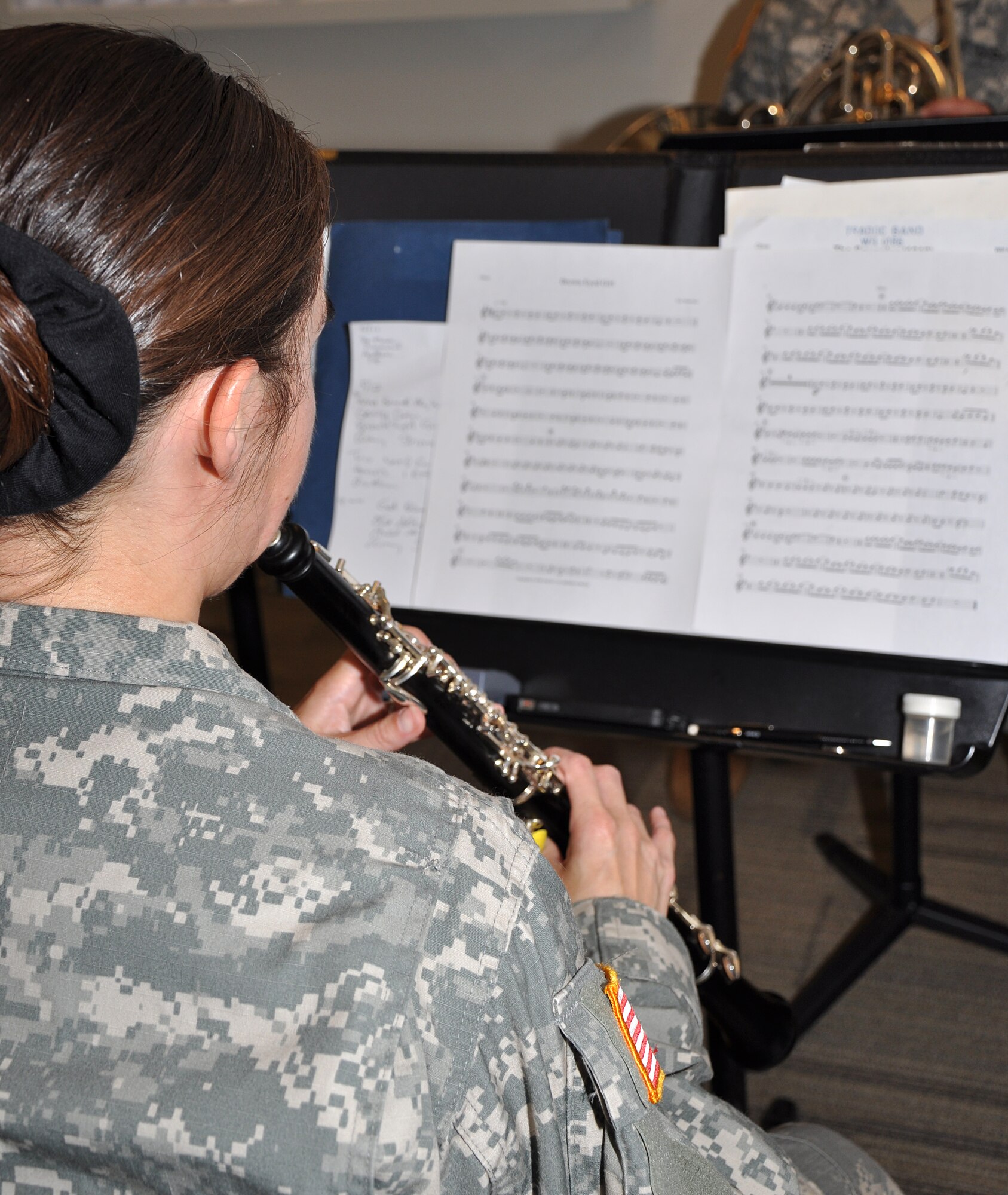 Staff Sgt. Holly Schultz, U.S. Training and Doctrine Command Band oboist and senior noncommissioned officer in charge of human resources, practices for an upcoming event May 8, 2013 at Fort Eustis, Va. Schultz is one of the six Soldiers who make up the TRADOC Winds woodwind ensemble. (U.S. Air Force photo by Tech. Sgt April Wickes/Released) 