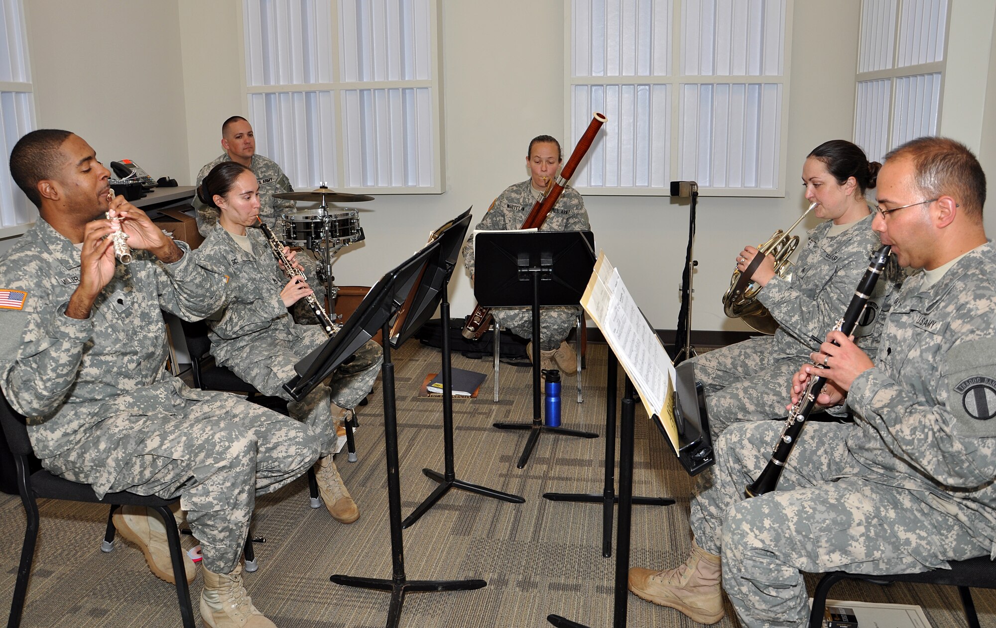 The TRADOC Winds woodwind ensemble practices for an upcoming retirement ceremony May 8, 2013 at Fort Eustis, Va.  The ensemble was recently awarded the 2012 Music Performance Team of the Year for the Woodwind Ensemble category. (U.S. Air Force photo by Tech. Sgt April Wickes/Released)