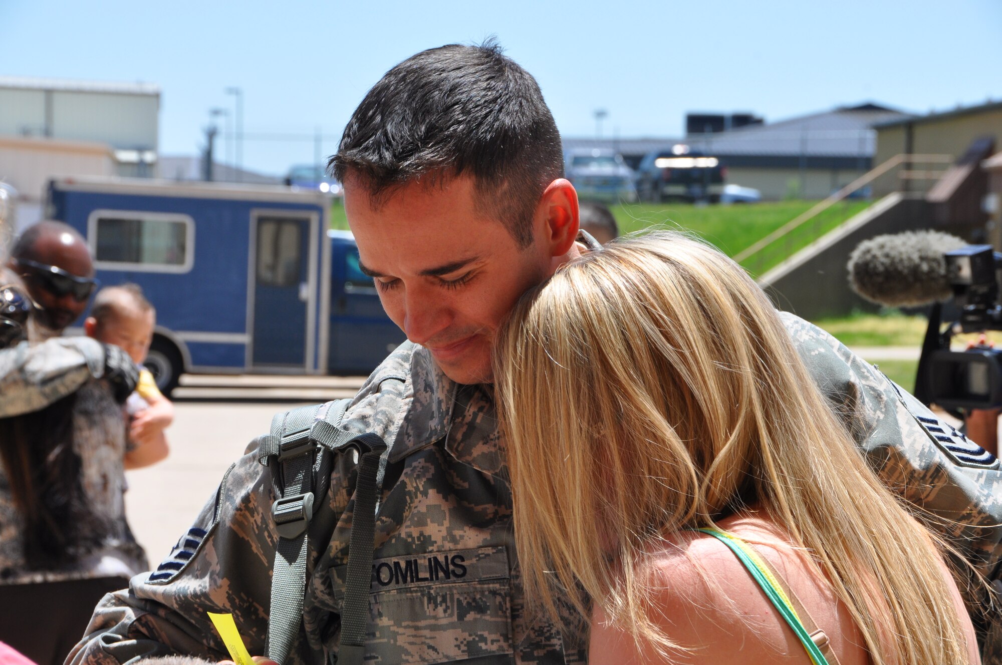 Master Sgt. James Tomlins greets his wife after returning from a five month deployment in South West Asia here May 13. (U.S. Air Force photo by Senior Airman Mark Hybers)  