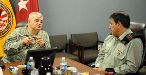 U.S. Army Maj. Gen. Jeff W. Mathis III, Joint Task Force Civil Support commander, speaks with Israeli Defense Force Maj. Gen. Yaakov Ayish, defense attaché to the U.S. and Canada, Israeli Defense Force Home Front Command, during a visit at Fort Eustis, Va., May 7, 2013. Ayish and his staff spent the day learning the wide variety of life-saving and sustaining response capabilities that JTF-CS oversees if ordered to respond to a catastrophic chemical, biological, radiological or nuclear incident in the homeland. (DOD photo by U.S. Navy Petty Officer 1st Class Brian Dietrick/Released) 

