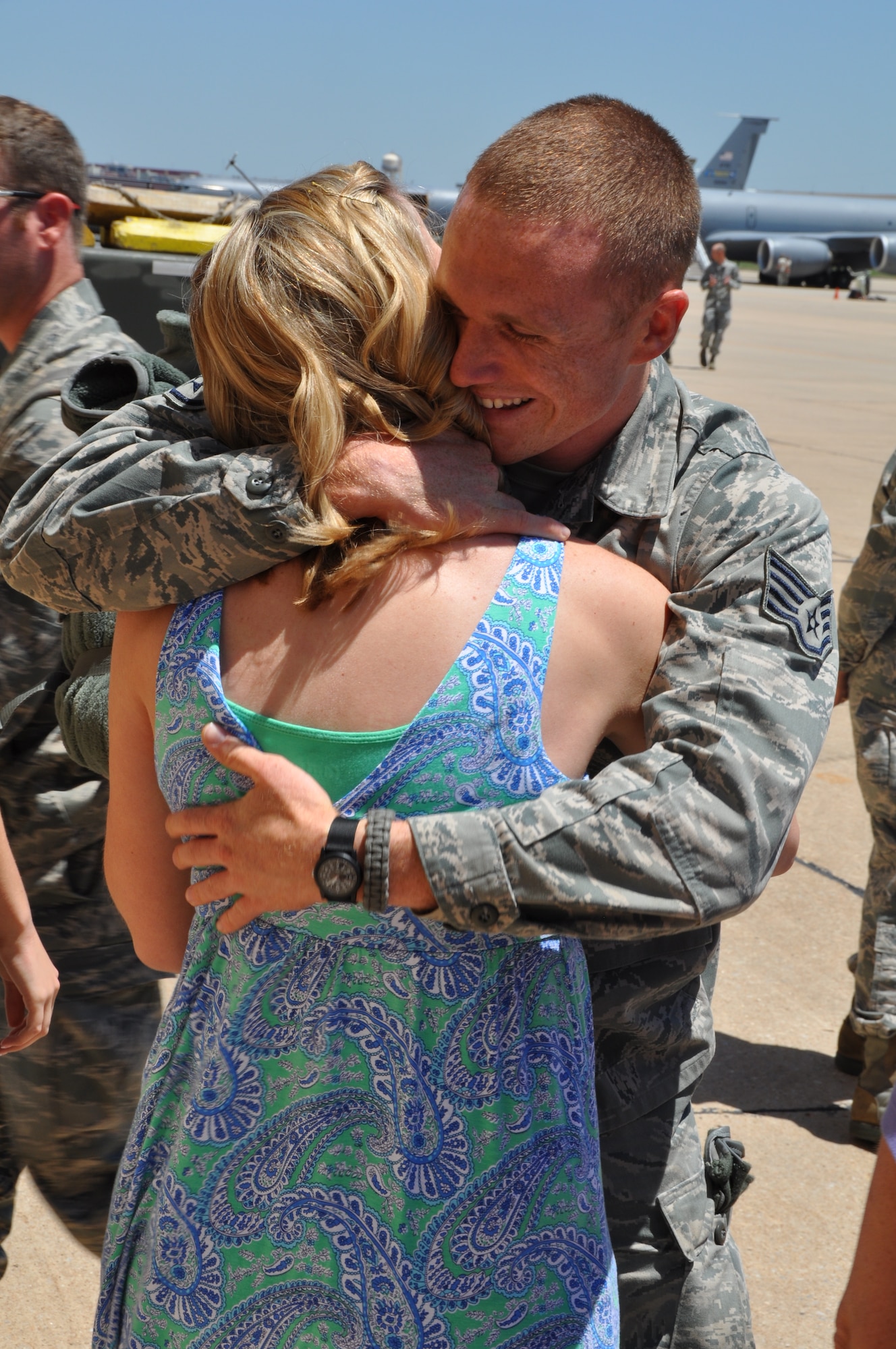 Staff Sgt. Robert Mills hugs his wife after returning from a five month deployment in South West Asia. (U.S. Air Force photo by Senior Airman Mark Hybers)