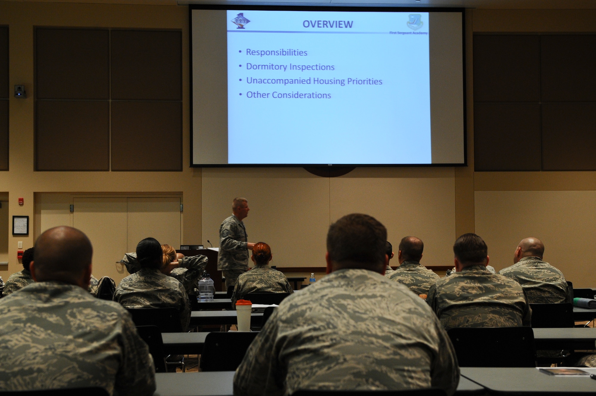 Additional-Duty First Sergeant Symposium participants listen to a lecture concerning dorm room inspections May 8, 2013, at the Leadership Development Center on Buckley Air Force Base, Colo. This training focused on the ability of a first sergeant to respond to a wide variety of scenarios not typically encountered as a supervisor. (U.S. Air Force photo by Senior Airman Phillip Houk/Released)
