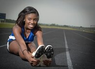 Natasha Atkins prepares herself by stretching in preparation of the state finals at the Joint Base San Antonio-Randolph High School May 9, 2013. (U.S. Air Force photo by Joshua Rodriguez) (released)