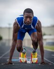 Leo Blont prepares himself on the starting block in preparation of the state finals at the Joint Base San Antonio-Randolph High School May 8, 2013. (U.S. Air Force photo by Joshua Rodriguez) (released)