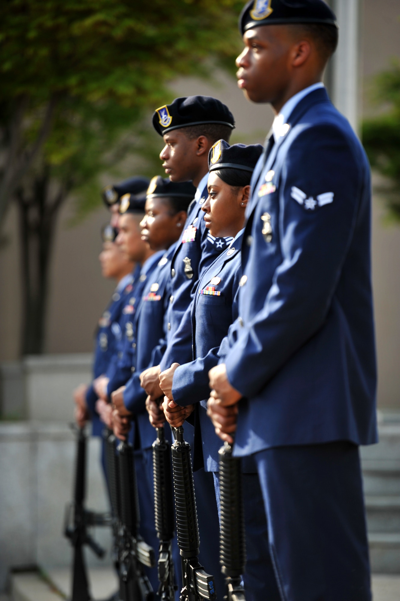 Members of the 51st Security Forces Squadron rifle team standby before rendering a 21-gun salute during a retreat ceremony held to honor fallen defenders and Office of Special Investigations agents at Osan Air Base, Republic of Korea, May 13, 2013. The ceremony kicked off an annual week-long observance that honors the memory and sacrifices made by individuals in the security forces and Office of Special Investigations career fields. (U.S. Air Force photo/Staff Sgt. Emerson Nuñez)