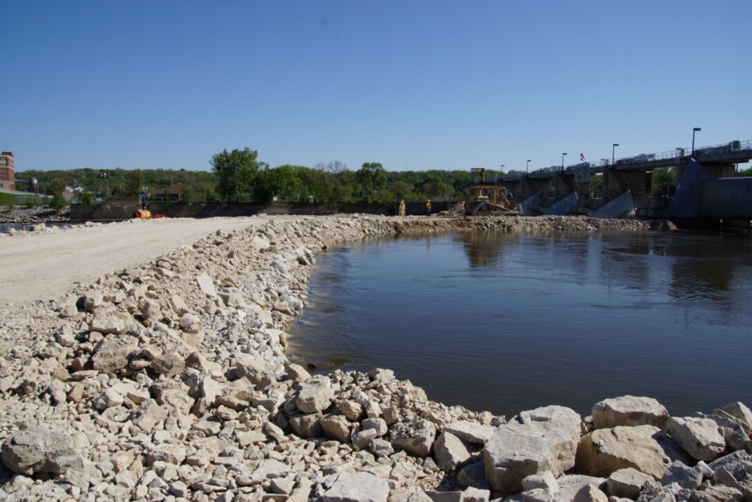 The Army Corps of Engineers built a temporary rock dike just below Marseilles Dam on the Illinois River to reduce river flows and facilitate repairs to the dam. The dike was constructed using approximately 42,000 tons of rock and stretches more than 300 feet. 