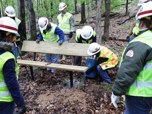 U.S. Army Corps of Engineers Tulsa District Leadership Development II team members work to install a new park bench at Fort Gibson Lake April 18. The group was there as part of a field trip to learn about the Civil Works projects of the district.