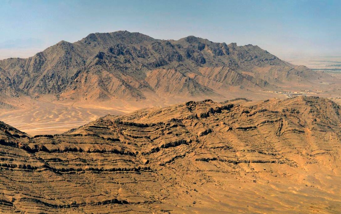 Jagged, rocky and barren mountains make up the rugged terrain that surrounds Firebase Maholic as U.S. Deputy Defense Secretary Ash Carter visits forward bases in Afghanistan, May 14, 2013. 