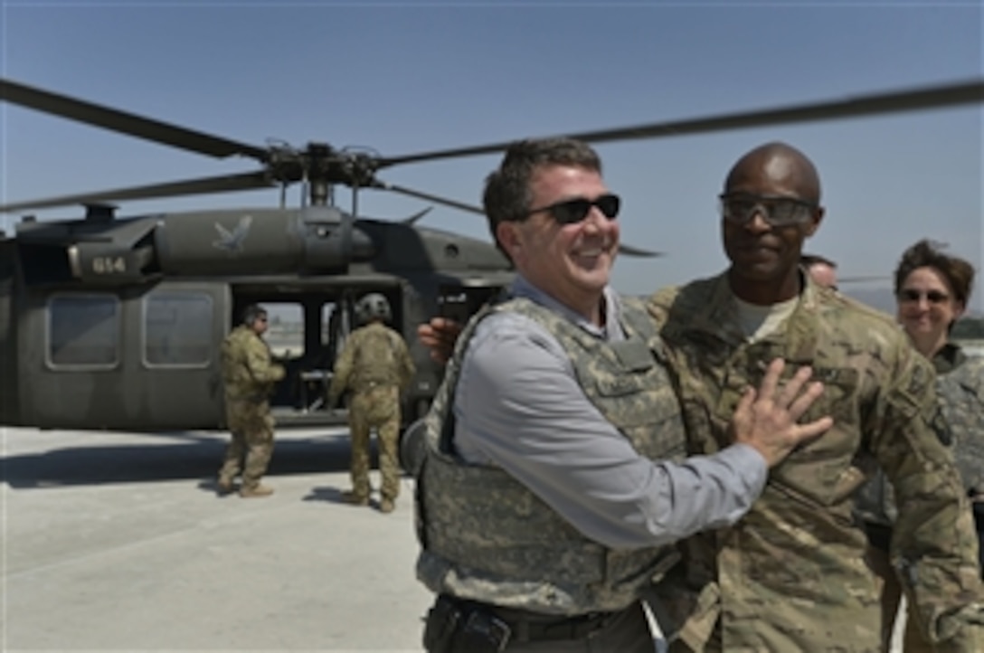 Deputy Secretary of Defense Ashton B. Carter receives a warm welcome from Brig. Gen. Ron Lewis as he arrives at Jalalabad Air Base in the Nangarhar province of Afghanistan on May 13, 2013.  Lewis and other senior leaders will brief Carter on the operational and strategic-level reviews of the security transition and retrograde.  Lewis is the Regional Command East deputy commanding general for support.  