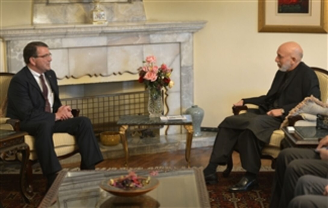 Deputy Secretary of Defense Ashton B. Carter, left, meets with Afghanistan's President Hamid Karzai at the presidential palace in Kabul, Afghanistan, on May 13, 2013.  Carter congratulated Karzai on the progress of the Afghan national security forces and reiterated the U.S. commitment to support the Afghan forces.  