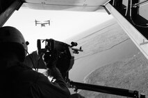 Lance Cpl. Tyler Savely, Marine Medium Tiltrotor Squadron 263 crew chief, fires an M240B machine gun out the back of an MV-22B Osprey during a field training exercise, May 7.
