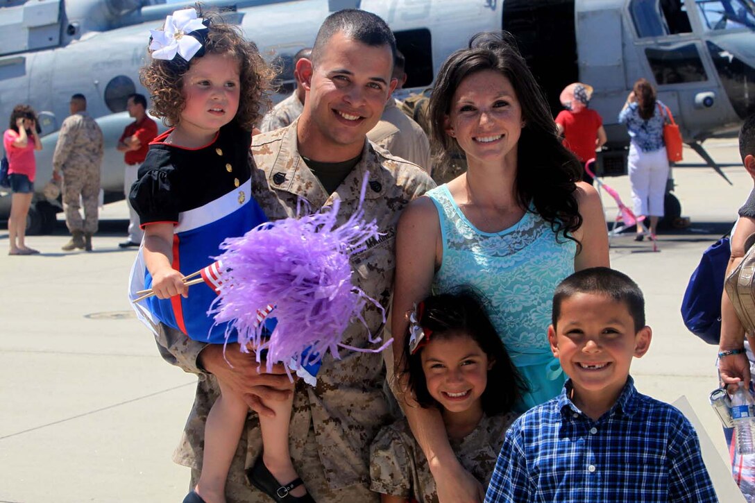 After and eight-month deployment, a Marine with Marine Medium Helicopter Squadron 364 (Reinforced), the aviation combat element for the 15th Marine Expeditionary Unit, reunites with his family during their homecoming at Camp Pendleton, May 13. While deployed, the Marines acted as a forward-deployed, sea-based Marine Air Ground Task Force capable of conducting a wide variety of operations from humanitarian assistance to combat related missions.