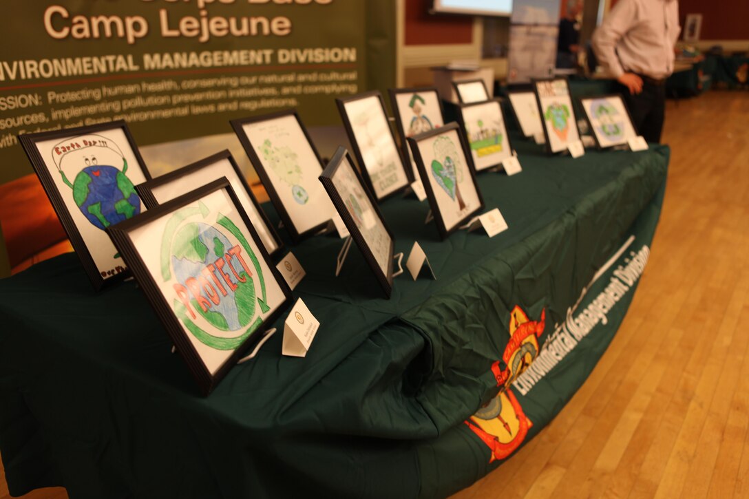 Brewster Middle School and Lejeune High School Students’ designs are displayed during the 10th Annual Earth Day Fair and Art Contest at the Marston Pavilion aboard Marine Corps Base Camp Lejeune April 24. The winners’ designed were comprised the Earth Day designs for the year. (Photo by Pfc. Justin A. Rodriguez/released)