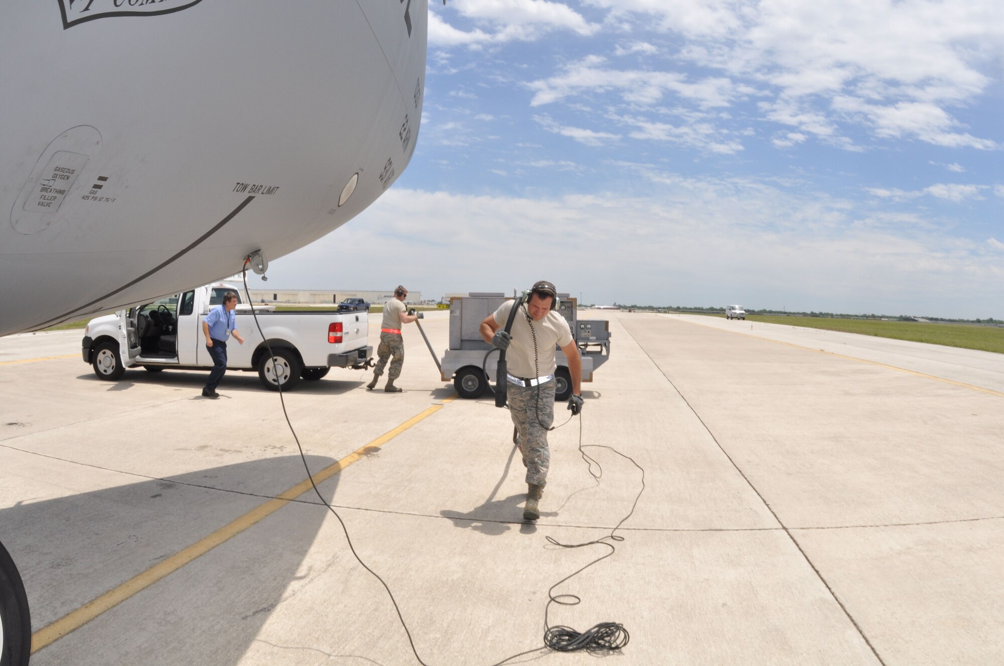 Tech Sgt. Scott Perkins, a crew chief with the 931st Aircraft Maintenance Squadron, prepares to connect a ground generator to a KC-135 Stratotanker during pre-flight checks, May 12. (Air Force photo by Master Sgt. Brannen Parrish)