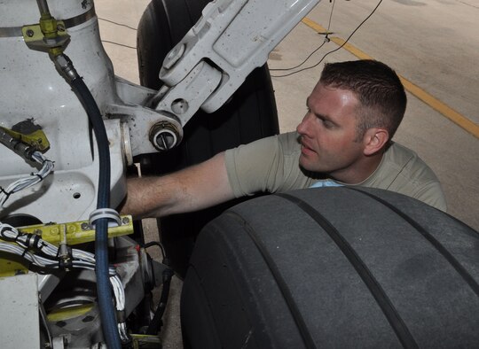 Staff Sgt. Kevin Bolden, a crew chief from the 931st AMXS, cleans the landing gear on a KC-135 Stratotanker at Joint Base San Antonio, May 12. (Air Force photo by Master Sgt. Brannen Parrish)
