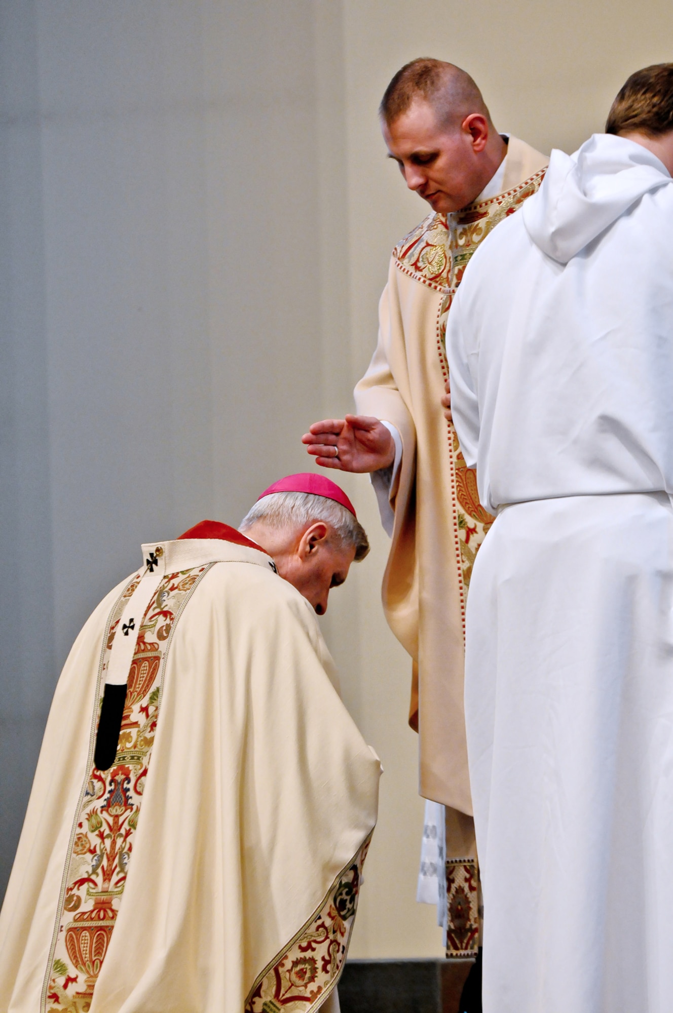 Former Anglican priest and U.S. Army Maj. Ken Bolin, brigade chaplain for the 4th Brigade Combat Team (Airborne), 25th Infantry Division, gives his first blessing as an ordained priest to Anchorage Archbishop Robert Schwietz at Our Lady of Guadalupe Parish March 7th. As an ordained priest, Bolin is authorized to celebrate both the standard Roman Missal Mass as well as the adapted Anglican Mass. Bolin is the newest of five married Catholic priests to currently serve in the chaplain corps on active duty in the U.S. Army. (Photo by U.S. Army Sgt. Eric-James Estrada)