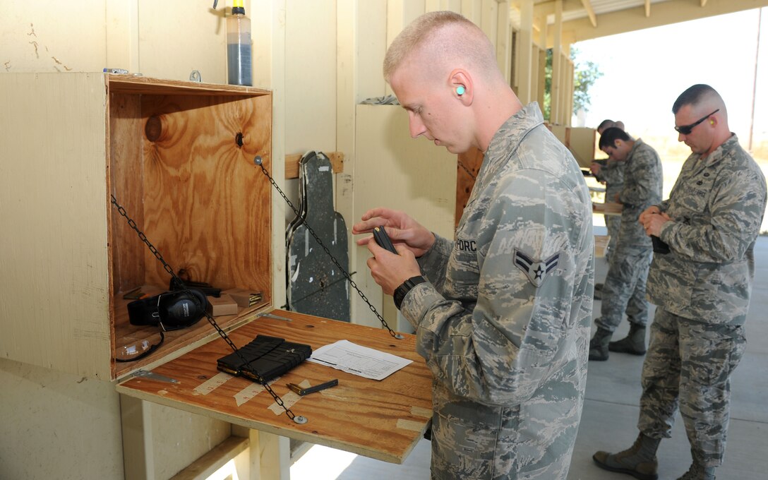 Airman 1st Class Justin Frazier, 9th Aircraft Maintenance Squadron U-2 crew chief, loads a magazine at the Combat Arms Training and Maintenance range on Beale Air Force Base, Calif., May 14, 2013. Beale Airmen competed in a M16 rifle competition in honor of police week. (U.S. Air Force photo by Airman 1st Class Bobby Cummings/Released)
