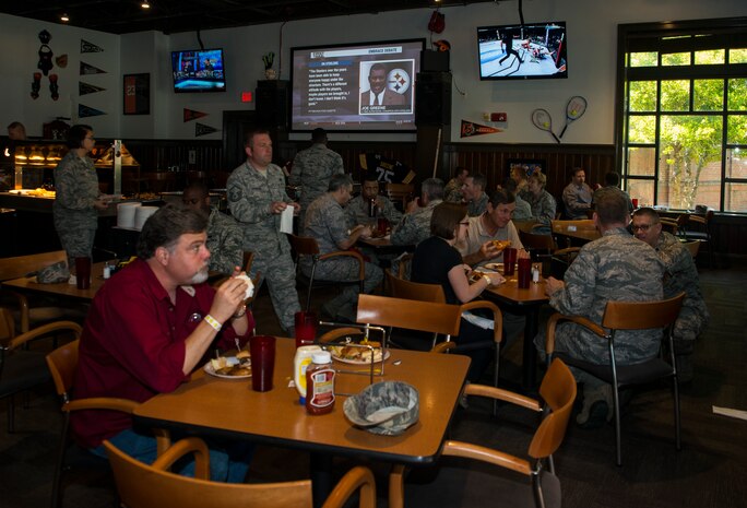 Team Charleston personnel enjoy food and entertainment during the Rookies Sports Grill one-year anniversary celebration May 8, 2013, at Joint Base Charleston – Air Base, S.C. The event included a live band, hot dog eating contest and buffet for service members, retirees and their families members to try out new menu options. (U.S. Air Force photo/ Senior Airman Dennis Sloan)