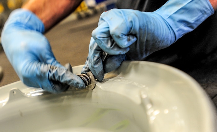 Staff Sgt. Justin Brandt, , 437th Maintenance Squadron repair and reclamation specialist,  installs a depot Required Delivery Date  tag putting the finishing touches on a reassembled C-17 Globemaster III wheel and tire May 14, 2013, at Joint Base Charleston – Air Base, S.C. Once complete, the wheel and tire will be sent to supply and distributed as needed. The 437th AMXS Repair and Reclamation shop is trained and equipped to be dispatched on short notice to crash sites for aircraft recovery.  (U.S. Air Force photo / Airman 1st Class Tom Brading)

